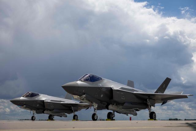 Two US-made F-35 aircrafts (Polish codename Husarz) of the Polish Air Force are seen parked on the tarmac at the 32nd Tactical Air Base in Lask, central Poland, on June 12, 2026, on the day of their official entry into service with the Polish Air Force. (Photo by Wojtek RADWANSKI / AFP)