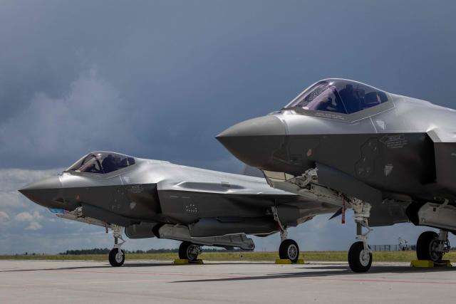 Two US-made F-35 aircrafts (Polish codename Husarz) of the Polish Air Force are seen parked on the tarmac at the 32nd Tactical Air Base in Lask, central Poland, on June 12, 2026, on the day of their official entry into service with the Polish Air Force. (Photo by Wojtek RADWANSKI / AFP)