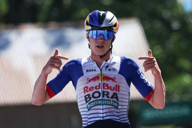 Red Bull - Bora - Hansgrohe's Belgian rider Maxim Van Gils celebrates as he cycles across the finish line to win the 6th stage of the Tour Auvergne-Rhone-Alpes cycling race (formerly known as the Criterium du Dauphine), 182,3km between Saint-Vulbas and Crest-Voland in the French Alps on June 12, 2026. (Photo by Anne-Christine POUJOULAT / AFP)