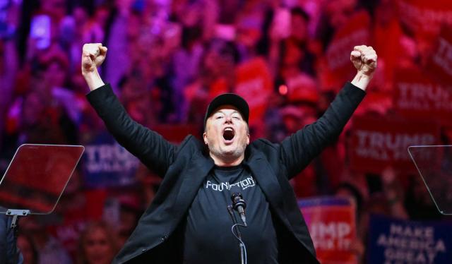 (FILES) Tesla and SpaceX CEO Elon Musk gestures as he steps on stage during a rally for former US President and Republican presidential candidate Donald Trump at Madison Square Garden in New York, October 27, 2024. Elon Musk's SpaceX began its first day as a public company on Wall Street on June 12, 2026, after the biggest initial public offering in history, with the polarizing entrepreneur promising he will take humanity to Mars. The blockbuster operation, which raised more than $75 billion, is expected to make Musk the world's first trillionaire and kick off a series of major IPOs by AI companies in the coming months. (Photo by ANGELA WEISS / AFP)
