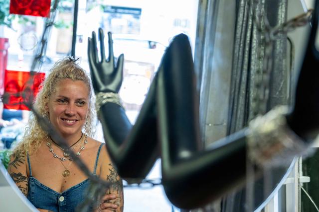 Recycled jewellery designer and founder of Capobianco, Juliette Moutte, poses in her workshop and shop, in the Camas neighbourhood of Marseille, on June 9, 2026. In Marseille, Slow Fashion Week is making its rebellious, popular, and sustainable mark on the fashion world: free and colourful fashion shows, open to all, featuring collections where secondhand textiles reign supreme. (Photo by MIGUEL MEDINA / AFP)