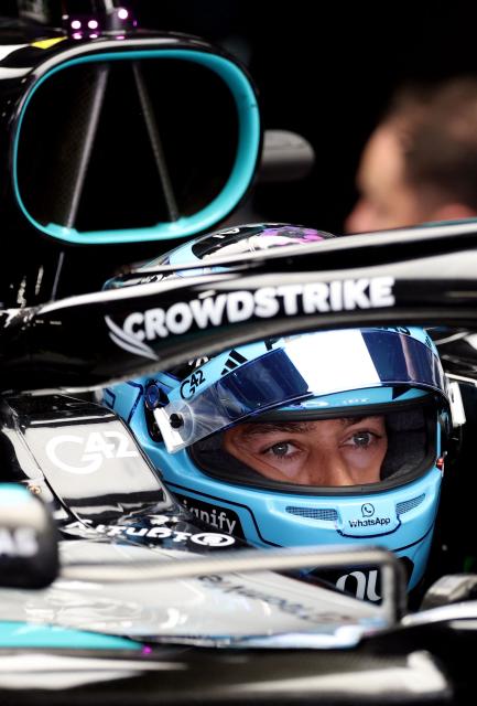 Mercedes' British driver George Russell prepares hilself for the second practice session at the Circuit de Catalunya ahead of the Catalonia Formula One Grand Prix in Montmelo, on the outskirts of Barcelona on June 12, 2026. (Photo by Lluis GENE / AFP)