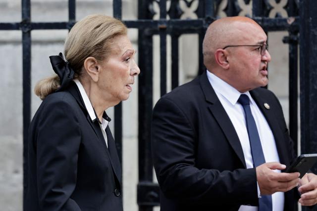 Farah Diba former wife of the last Shah of Iran (L) leaves at the end of the funeral ceremony for late Bernadette Chirac, widow of former French president Jacques Chirac at the Basilica Sainte-Clotilde, in Paris on June 12, 2026. Bernadette Chirac passed away at 93 years old on June 5. She stood by her late husband, former French president Jacques Chirac, during 12 years as first lady, but also forged her own, more discreet, political career. (Photo by STEPHANE DE SAKUTIN / AFP)