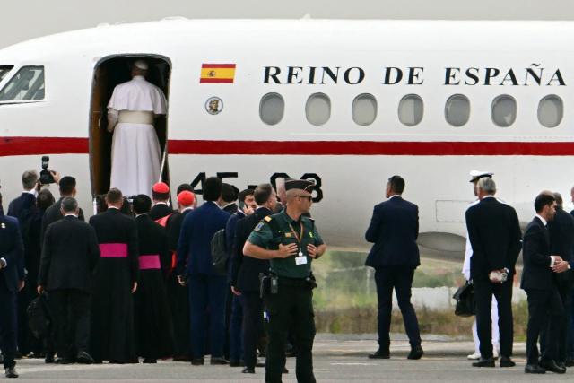 Pope Leo XIV embarks a new aircraft offered by Spanish King Felipe VI (L) after his first plane's takeoff was delayed due to an incident at Los Rodeos International Airport on the Canary Island of Tenerife on June 12, 2026. Pope Leo XIV will return to Rome from the Canary Islands today on a plane offered by Spanish King Felipe VI after his orginal aircraft suffered a technical glitch, the Vatican said. The flight is scheduled to depart Tenerife at 6 pm (1700 GMT) and arrive in Rome at around 11 pm, it said in a statement. (Photo by Stefano RELLANDINI / AFP)