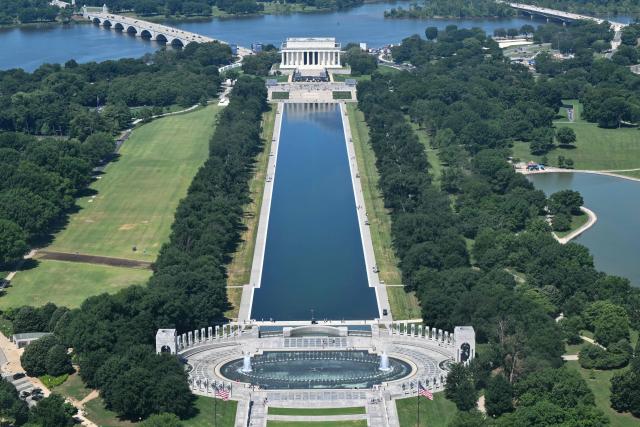 A view of the newly resurfaced Reflecting Pool on the National Mall in Washington, DC, on June 12, 2026. US President Donald Trump has unleashed a significant public works program in Washington since returning to office last year, refurbishing a series of monuments, knocking down the East Wing of the White House to build a ballroom and planning a huge triumphal arch. (Photo by Anne LEBRETON / AFP)