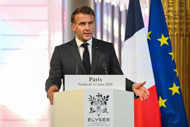 France's President Emmanuel Macron gestures as he addresses the media during a press conference with Canada's Prime Minister Mark Carney (not pictured) ahead of a bilateral meeting at The Elysee Presidential Palace, in Paris on June 12, 2026. (Photo by POOL / AFP)