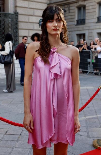 French singer Marguerite poses ahead of the Fier Gala, a festive and charitable event to support LGBTQ+ rights, at the National Theatre of the Opera Comique in Paris on June 12, 2026. (Photo by Kenzo TRIBOUILLARD / AFP)