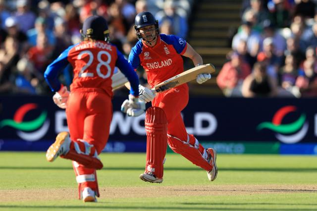England's Amy Jones and England's Danni Wyatt-Hodge run between wickets on the first day of during the ICC Women's T20 cricket World Cup 2026 Group 2 stage cricket match between England and Sri Lanka at Edgbaston cricket ground in Birmingham, central England on June 12, 2026. (Photo by Darren Staples / AFP)