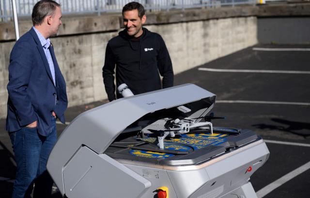 Skydio CEO Adam Bry (R) demonstrates the Skydio X10 drone to US Trade Representative Jamieson Greer (L) as Greer tours the SkyDio drone manufacturing facility in Hayward, California, on June 12, 2026. (Photo by Josh Edelson / AFP)