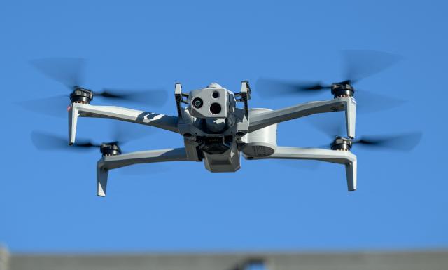 The Skydio X10 drone flies as US Trade Representative Jamieson Greer tours the SkyDio Drone manufacturing facility in Hayward, California, on June 12, 2026. (Photo by Josh Edelson / AFP)