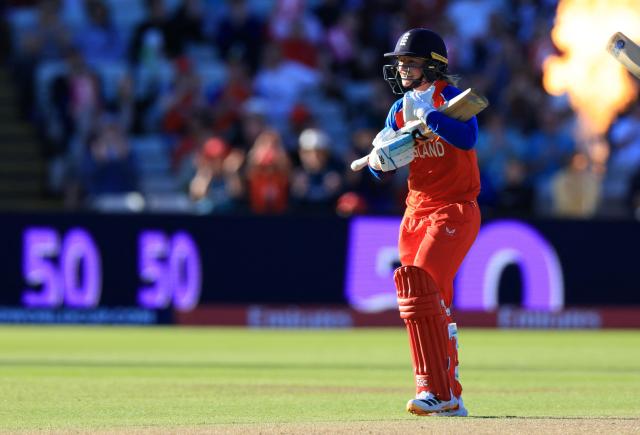 England's Danni Wyatt-Hodge celebrates her half-century on the first day of the ICC Women's T20 cricket World Cup 2026 Group 2 stage cricket match between England and Sri Lanka at Edgbaston cricket ground in Birmingham, central England on June 12, 2026. (Photo by Darren Staples / AFP)