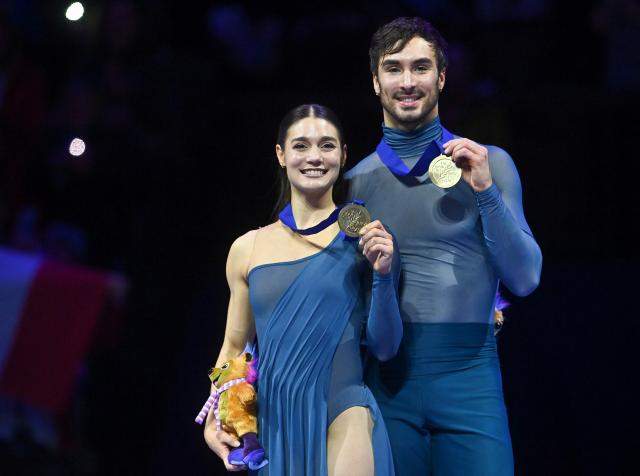 (FILES) Winner France's Laurence Fournier Beaudry and Guillaume Cizeron pose with their medals on the podium of the Ice Dance Free Dance program of the 2026 ISU Figure Skating World Championships in Prague, Czech Republic on March 28, 2026. Guillaume Cizeron and Laurence Fournier Beaudry, Olympic ice dance champions in Milan four months ago, announced on June 12, 2026, that they were continuing their partnership with the aim of competing at the 2030 Winter Olympics in the French Alps. (Photo by Michal Cizek / AFP)