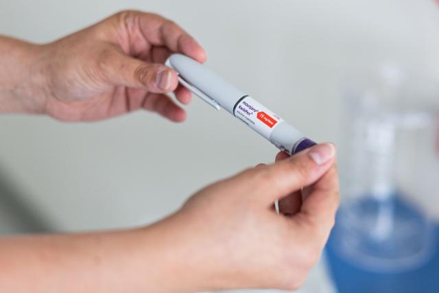 This photograph shows a KwikPen of the drug Mounjaro, containing the active ingredient tirzepatide, used in the treatment of obesity, at the Valenciennes Hospital Centre (Centre Hospitalier de Valenciennes) in Valenciennes, northern France on June 12, 2026. (Photo by Sameer Al-DOUMY / AFP)