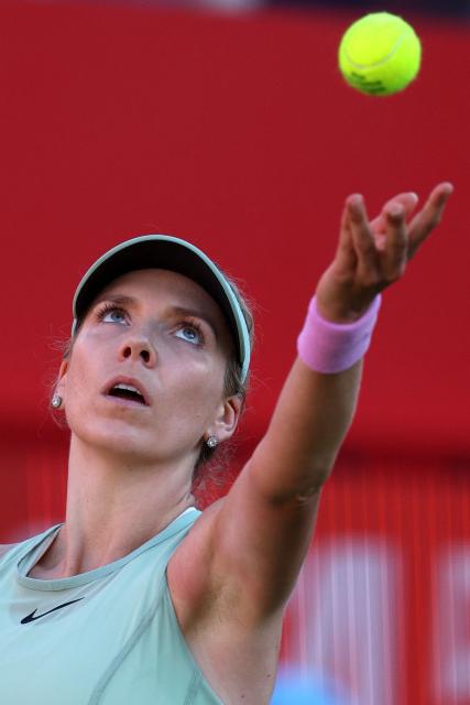 Britain's Katie Boulter serves against Kazakhstan's Elena Rybakina during their women's singles quarter-final tennis match at the HSBC WTA Championships at Queen's Club in west London on June 12, 2026. (Photo by Adrian Dennis / AFP)