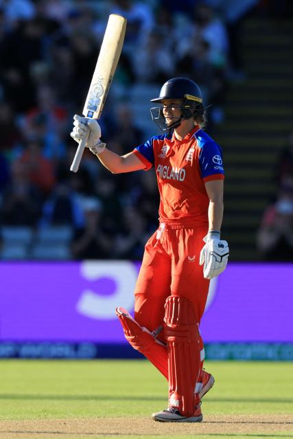 England's Amy Jones celebrates her half-century on the first day of the ICC Women's T20 cricket World Cup 2026 Group 2 stage cricket match between England and Sri Lanka at Edgbaston cricket ground in Birmingham, central England on June 12, 2026. (Photo by Darren Staples / AFP)