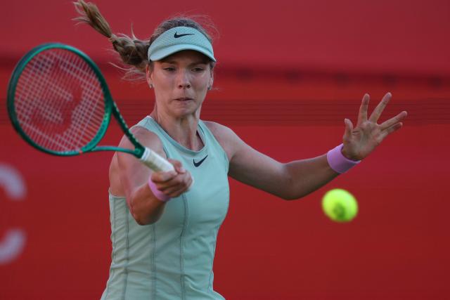 Britain's Katie Boulter returns against Kazakhstan's Elena Rybakina during their women's singles quarter-final tennis match at the HSBC WTA Championships at Queen's Club in west London on June 12, 2026. (Photo by Adrian Dennis / AFP)