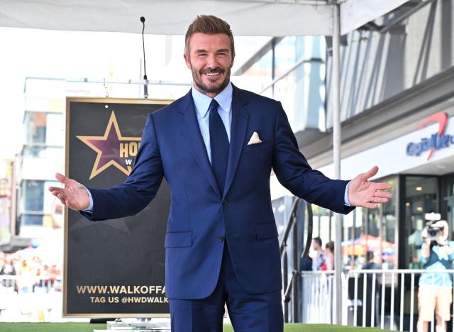 English former footballer David Beckham poses at his newly unveiled Hollywood Walk of Fame star during a ceremony in Hollywood, California, on June 12, 2026. (Photo by LISA O'CONNOR / AFP)