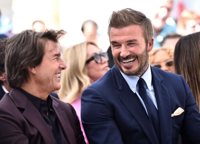 English former footballer David Beckham and US actor Tom Cruise laugh during his Hollywood Walk of Fame star ceremony in Hollywood, California, on June 12, 2026. (Photo by LISA O'CONNOR / AFP)