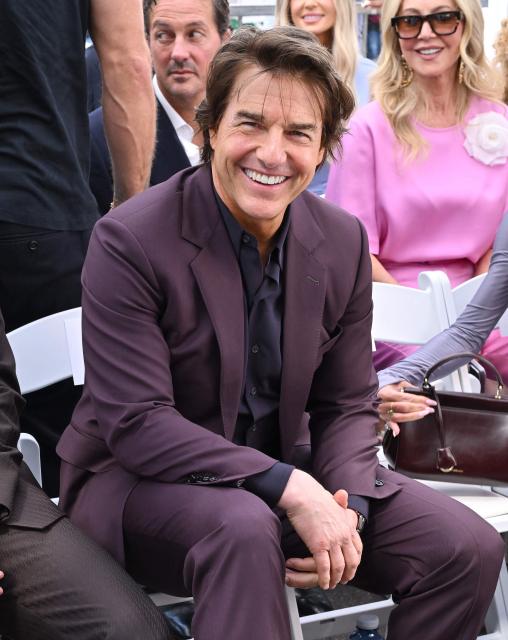 US actor Tom Cruise attend English former footballer David Beckham's Hollywood Walk of Fame star ceremony in Hollywood, California, on June 12, 2026. (Photo by LISA O'CONNOR / AFP)