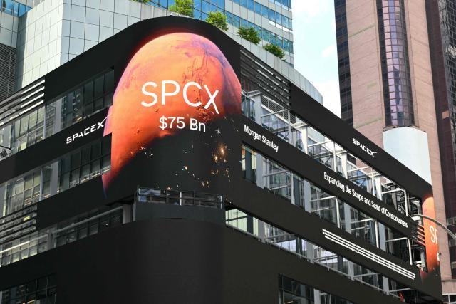 SpaceX advertisements are seen on a digital billboard on a building in Times Square to celebrate the launch of SpaceXs initial public offering (IPO) in New York on June 12, 2026. Elon Musk's SpaceX begins trading on the Nasdaq exchange on Friday with the biggest initial public offering in history expected to make the polarizing entrepreneur the world's first trillionaire. The company priced more than 555 million shares at $135 each in a filing with the US markets regulator on Thursday, placing SpaceX in the top 10 of Wall Street's biggest companies with a valuation of just under $1.8 trillion -- ahead of Tesla, Facebook-owner Meta and Walmart. (Photo by ANGELA WEISS / AFP)