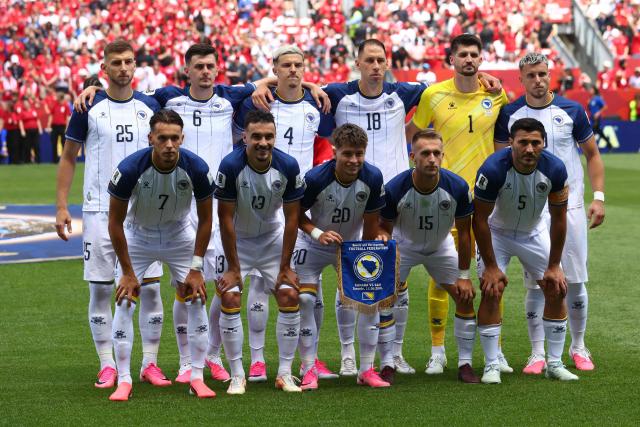 (From L) Bosnia-Herzegovina's forward #25 Jovo Lukic, Bosnia-Herzegovina's defender #07 Amar Dedic, Bosnia-Herzegovina's midfielder #06 Benjamin Tahirovic, Bosnia-Herzegovina's midfielder #13 Ivan Basic, Bosnia-Herzegovina's defender #04 Tarik Muharemovic, Bosnia-Herzegovina's forward #20 Esmir Bajraktarevic, Bosnia-Herzegovina's defender #18 Nikola Katic, Bosnia-Herzegovina's forward #15 Amar Memic, Bosnia-Herzegovina's goalkeeper #01 Nikola Vasilj, Bosnia-Herzegovina's defender #05 Sead Kolasinac and Bosnia-Herzegovina's forward #10 Ermedin Demirovic pose before the 2026 World Cup Group B football match between Canada and Bosnia and Herzegovina at the Toronto Stadium in Toronto on June 12, 2026. (Photo by Cole Burston / AFP)