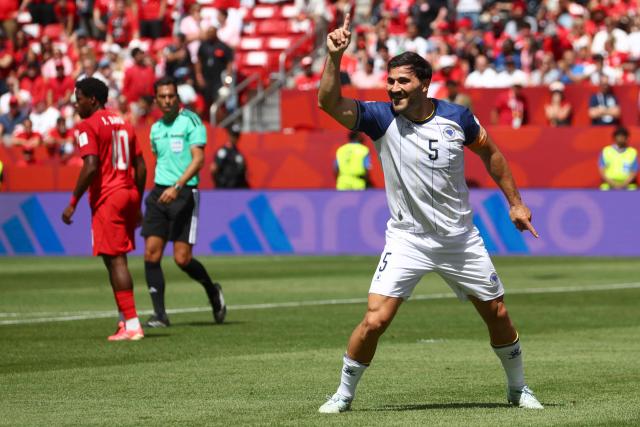 Bosnia-Herzegovina's defender #05 Sead Kolasinac celebrates his team goal during the 2026 World Cup Group B football match between Canada and Bosnia and Herzegovina at the Toronto Stadium in Toronto on June 12, 2026. (Photo by Cole Burston / AFP)