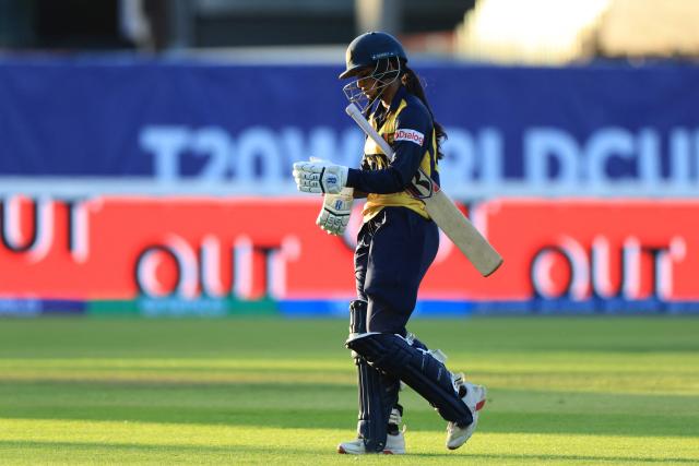 Sri Lanka's Vishmi Gunarathne walks back to the pavilion after losing her wicket on the first day of the ICC Women's T20 cricket World Cup 2026 Group 2 stage cricket match between England and Sri Lanka at Edgbaston cricket ground in Birmingham, central England on June 12, 2026. (Photo by Darren Staples / AFP)