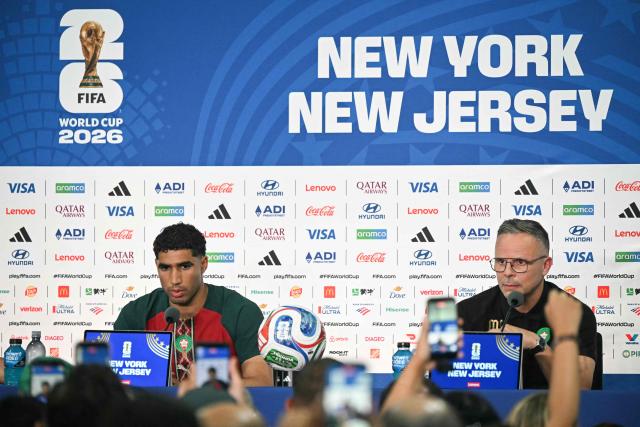 Morocco's head coach Mohamed Ouahbi (R) speaks during a press conference at the New York/New Jersey Stadium in East Rutherford on June 12, 2026, on the eve of the 2026 World Cup football match between Brazil and Morocco. (Photo by Mauro PIMENTEL / AFP)