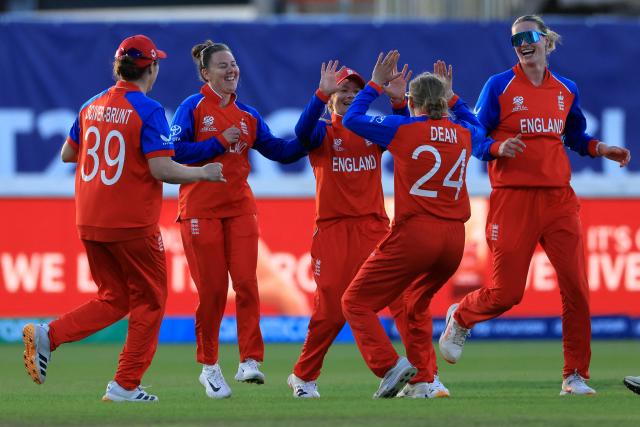 England's Danni Wyatt-Hodge (3L) celebrates taking the wicket of Sri Lanka's captain Chamari Athapaththu on the first day of the ICC Women's T20 cricket World Cup 2026 Group 2 stage cricket match between England and Sri Lanka at Edgbaston cricket ground in Birmingham, central England on June 12, 2026. (Photo by Darren Staples / AFP)