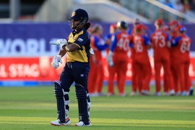 Sri Lanka's captain Chamari Athapaththu walks back to the pavilion after losing her wicket on the first day of the ICC Women's T20 cricket World Cup 2026 Group 2 stage cricket match between England and Sri Lanka at Edgbaston cricket ground in Birmingham, central England on June 12, 2026. (Photo by Darren Staples / AFP)