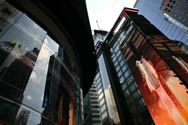 A SpaceX ad is displayed on a screen in Times Square near the Nasdaq MarketSite after the launch of SpaceX’s initial public offering (IPO) in New York on June 12, 2026. Shares in Elon Musk's SpaceX jumped as much as 30 percent on their trading debut after the biggest IPO in history, making the polarizing entrepreneur the world's first trillionaire as he vowed to take humanity to Mars. (Photo by ANGELA WEISS / AFP)
