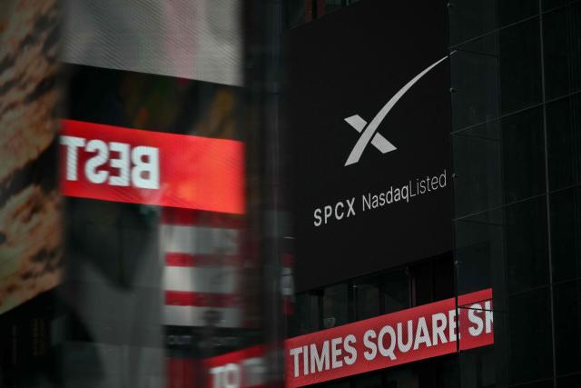An ad for SpaceX is displayed on a screen at Times Square after the launch of SpaceX’s initial public offering (IPO) in New York on June 12, 2026. Shares in Elon Musk's SpaceX jumped as much as 30 percent on their trading debut after the biggest IPO in history, making the polarizing entrepreneur the world's first trillionaire as he vowed to take humanity to Mars. (Photo by ANGELA WEISS / AFP)