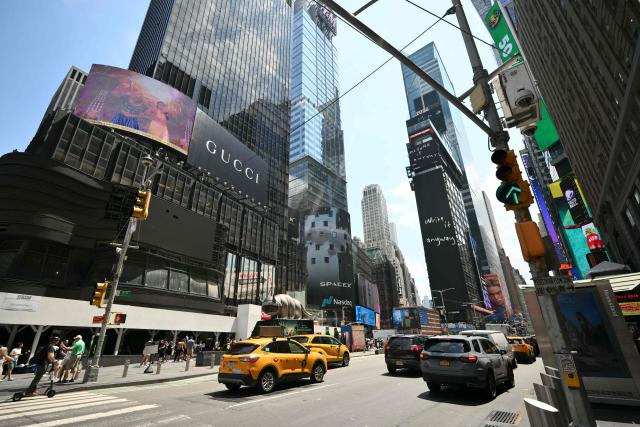 An ad for SpaceX is displayed on a screen at Times Square after the launch of SpaceX’s initial public offering (IPO) in New York on June 12, 2026. Shares in Elon Musk's SpaceX jumped as much as 30 percent on their trading debut after the biggest IPO in history, making the polarizing entrepreneur the world's first trillionaire as he vowed to take humanity to Mars. (Photo by ANGELA WEISS / AFP)