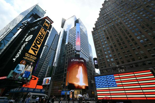An ad for Elon Musk's Starlink is displayed on a screen at Times Square after the launch of SpaceX’s initial public offering (IPO) in New York on June 12, 2026. Shares in Elon Musk's SpaceX jumped as much as 30 percent on their trading debut after the biggest IPO in history, making the polarizing entrepreneur the world's first trillionaire as he vowed to take humanity to Mars. (Photo by ANGELA WEISS / AFP)