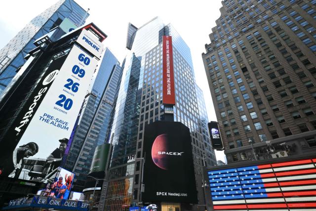 A SpaceX ad is displayed on a screen in Times Square near the Nasdaq MarketSite after the launch of SpaceX’s initial public offering (IPO) in New York on June 12, 2026. Shares in Elon Musk's SpaceX jumped as much as 30 percent on their trading debut after the biggest IPO in history, making the polarizing entrepreneur the world's first trillionaire as he vowed to take humanity to Mars. (Photo by ANGELA WEISS / AFP)