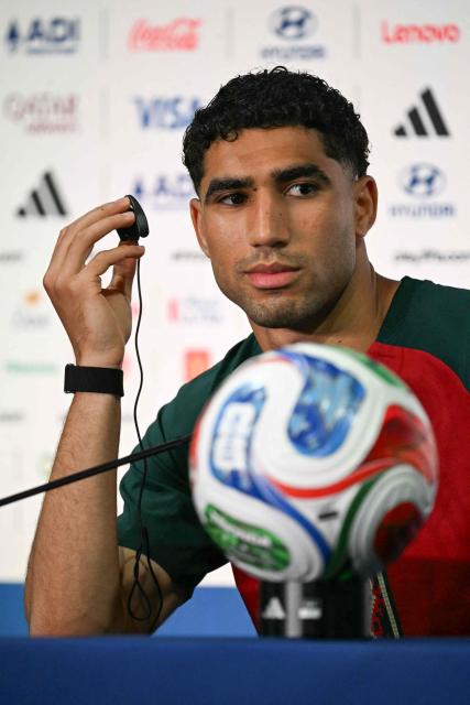 Morocco's defender #02 Achraf Hakimi reacts during a press conference at the New York/New Jersey Stadium in East Rutherford on June 12, 2026, on the eve of the 2026 World Cup football match between Brazil and Morocco. (Photo by Mauro PIMENTEL / AFP)