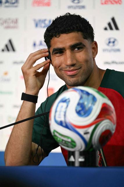 Morocco's defender #02 Achraf Hakimi reacts during a press conference at the New York/New Jersey Stadium in East Rutherford on June 12, 2026, on the eve of the 2026 World Cup football match between Brazil and Morocco. (Photo by Mauro PIMENTEL / AFP)