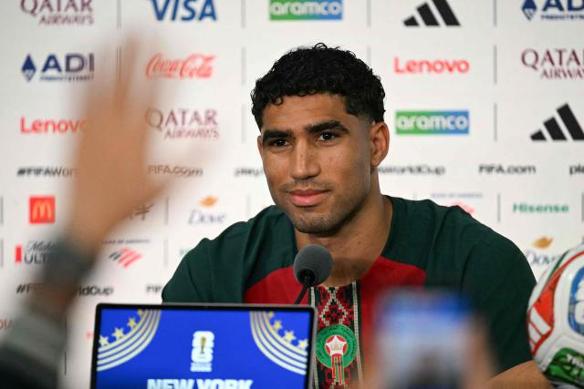 Morocco's defender #02 Achraf Hakimi gestures during a press conference at the New York/New Jersey Stadium in East Rutherford on June 12, 2026, on the eve of the 2026 World Cup football match between Brazil and Morocco. (Photo by Mauro PIMENTEL / AFP)