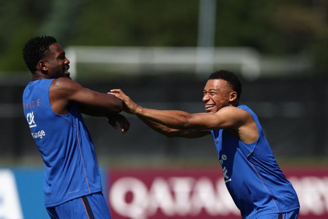 France's forward #10 Kylian Mbappe (R) jokes with France's forward #09 Marcus Thuram during training session at Bentley University, the team's base camp, as part of the 2026 World Cup football tournament in Waltham, near Boston, on June 12, 2026. (Photo by FRANCK FIFE / AFP)