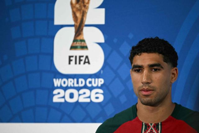 Morocco's defender #02 Achraf Hakimi gestures during a press conference at the New York/New Jersey Stadium in East Rutherford on June 12, 2026, on the eve of the 2026 World Cup football match between Brazil and Morocco. (Photo by Mauro PIMENTEL / AFP)