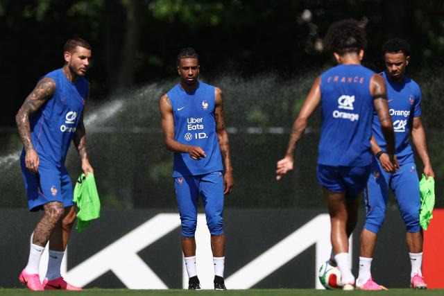 France's forward #11 Michael Olise (C) takes part in a training session at Bentley University, the team's base camp, during the 2026 World Cup football tournament in Waltham, near Boston, on June 12, 2026. (Photo by FRANCK FIFE / AFP)