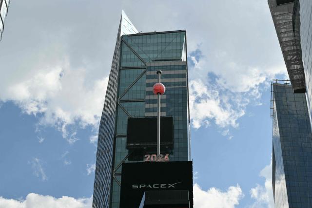 The Times Square crystal ball is raised for SpaceX’s initial public offering (IPO) in New York, on June 12, 2026. Shares in Elon Musk's SpaceX jumped as much as 30 percent on their trading debut after the biggest IPO in history, making the polarizing entrepreneur the world's first trillionaire as he vowed to take humanity to Mars. (Photo by ANGELA WEISS / AFP)