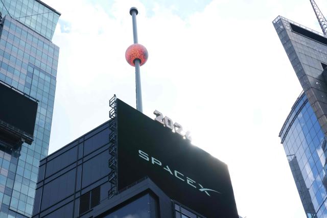 The Times Square crystal ball is dropped for SpaceX’s initial public offering (IPO) in New York, on June 12, 2026. Shares in Elon Musk's SpaceX jumped as much as 30 percent on their trading debut after the biggest IPO in history, making the polarizing entrepreneur the world's first trillionaire as he vowed to take humanity to Mars. (Photo by TIMOTHY A. CLARY / AFP)