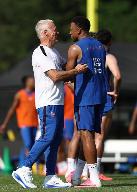 France's head coach Didier Deschamps (L) and France's forward #10 Kylian Mbappe react as they take part in a training session at Bentley University, the team's base camp, during the 2026 World Cup football tournament in Waltham, near Boston, on June 12, 2026. (Photo by FRANCK FIFE / AFP)