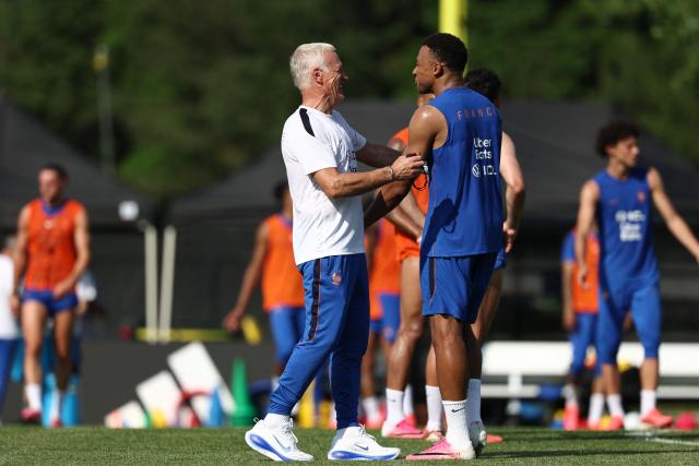France's head coach Didier Deschamps (L) and France's forward #10 Kylian Mbappe react as they take part in a training session at Bentley University, the team's base camp, during the 2026 World Cup football tournament in Waltham, near Boston, on June 12, 2026. (Photo by FRANCK FIFE / AFP)