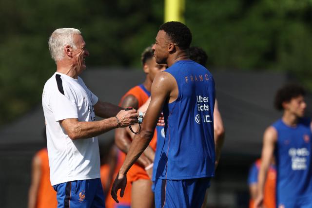 France's head coach Didier Deschamps (L) and France's forward #10 Kylian Mbappe react as they take part in a training session at Bentley University, the team's base camp, during the 2026 World Cup football tournament in Waltham, near Boston, on June 12, 2026. (Photo by FRANCK FIFE / AFP)