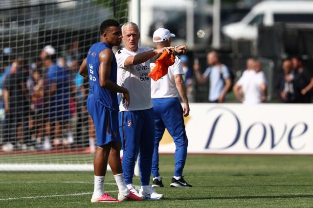 France's head coach Didier Deschamps (R) speaks with France's forward #10 Kylian Mbappe during a training session at Bentley University, the team's base camp, during the 2026 World Cup football tournament in Waltham, near Boston, on June 12, 2026. (Photo by FRANCK FIFE / AFP)