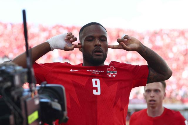 Canada's forward #09 Cyle Larin celebrates after scoring a goal during the 2026 World Cup Group B football match between Canada and Bosnia and Herzegovina at the Toronto Stadium in Toronto on June 12, 2026. (Photo by Cole Burston / AFP)
