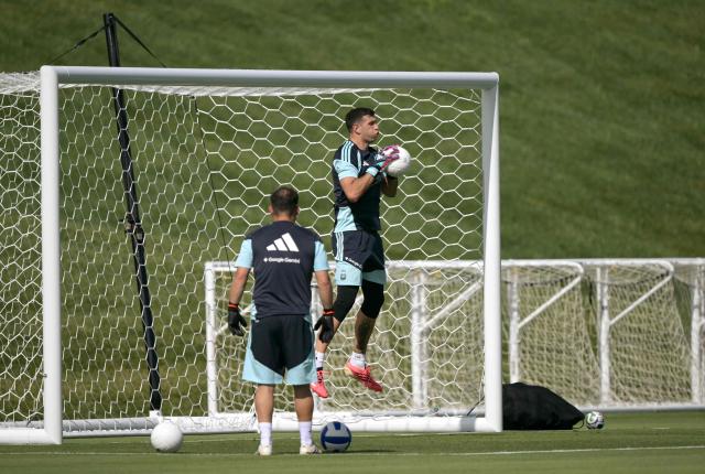 Argentina's goalkeeper #23 Emiliano Martinez catches a ball during a training session for the 2026 FIFA World Cup football tournament at Sporting KC Training Centre in Kansas City on June 12, 2026. (Photo by JUAN MABROMATA / AFP)