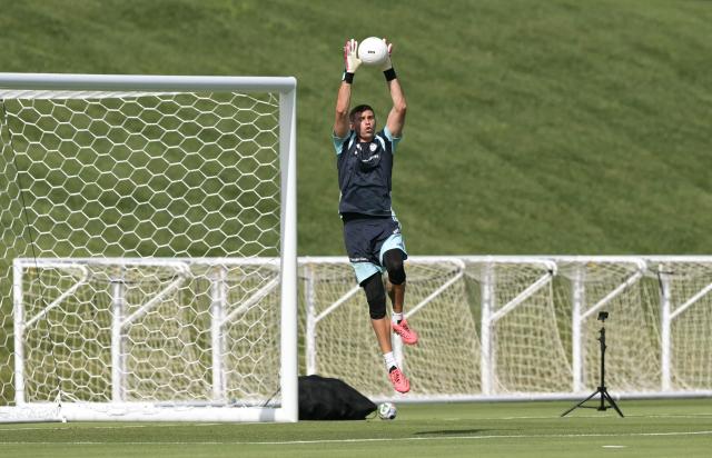 Argentina's goalkeeper #23 Emiliano Martinez catches a ball during a training session for the 2026 FIFA World Cup football tournament at Sporting KC Training Centre in Kansas City on June 12, 2026. (Photo by JUAN MABROMATA / AFP)